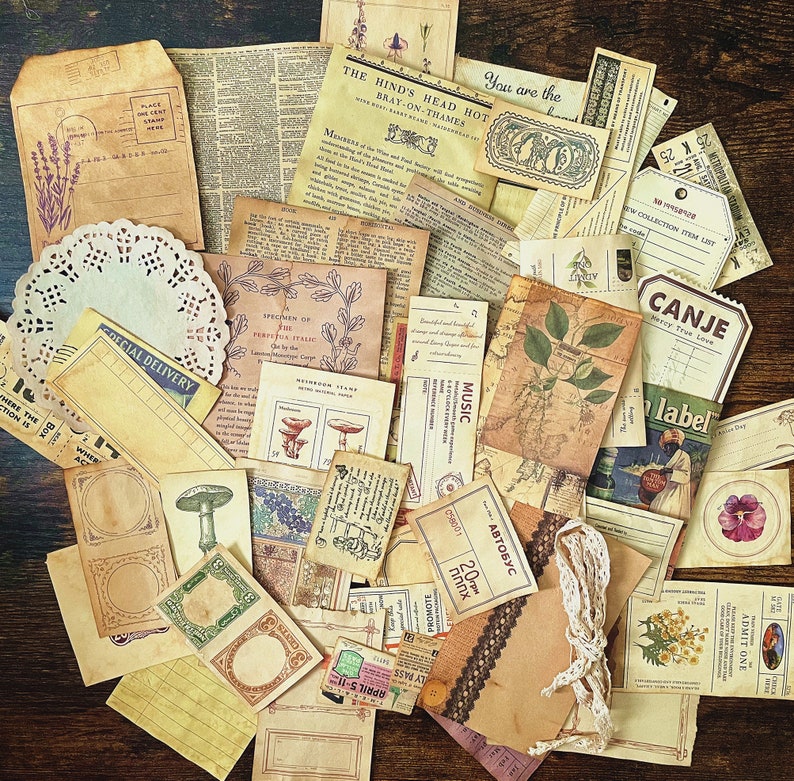 May include: A collection of vintage ephemera, including paper scraps, labels, and tags, with various designs and text. The items are in shades of brown, cream, and white, with some featuring floral motifs and handwritten text.