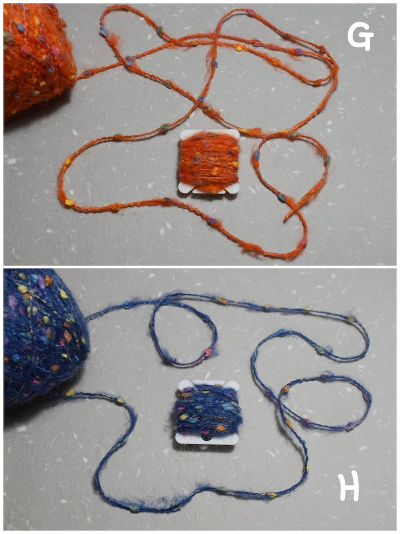 Puede incluir: Dos carretes de hilo, uno naranja y otro azul, con motas de colores por todas partes. Cada carrete est&aacute; enrollado con una longitud de hilo, y el hilo est&aacute; dispuesto en un bucle suelto.