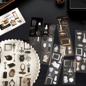 May include: A set of vintage-style stickers featuring various images, including keys, lanterns, teapots, hourglasses, and other antique-inspired designs. The stickers are printed on clear sheets and are perfect for adding a touch of vintage charm to journals, planners, or other craft projects.