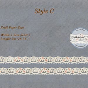 May include: Kraft paper tape, style C, with a decorative edge. The tape is 1.5cm (0.59") wide and 2m (78.74") long. The design features a repeating pattern of cream, gray, and coral-colored floral elements. The tape is labeled "Embroidered Edge".