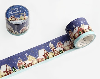 May include: A blue and white washi tape with a winter village scene. The tape features gold glitter accents and the text "Merry Christmas".
