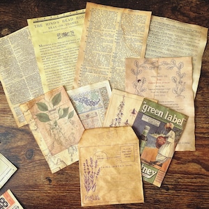 May include: A collection of vintage paper ephemera, including a postcard, a magazine cover, and several pages of text. The magazine cover features a green label and the text "green label" in white letters. The postcard is blank and has a floral design in the corner. The text pages are all yellowed with age and have various text printed on them.