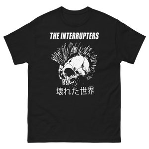 May include: Black t-shirt with a white graphic of a skull with a mohawk and the text "THE INTERRUPTERS" and "壊れた世界" in Japanese.