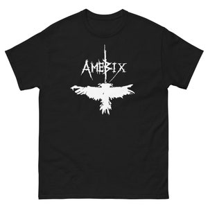 Könnte beinhalten: Schwarzes T-Shirt mit einem weißen Grafikdruck eines Vogels mit ausgebreiteten Flügeln und dem Wort "AMERIX" darüber.