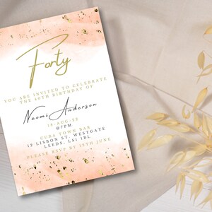 May include: A peach-coloured invitation with gold glitter accents. The invitation reads "Forty" in gold script and invites you to celebrate Naomi Anderson's 40th birthday at Cuba Town Bar on 18th August at 7pm. The address is 12 Lisbon St. Westgate, Leeds, LS1 IBL. Please RSVP by 12th June.