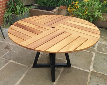 Handmade dining table. Outdoor garden / patio round hardwood table. Modern and stylish