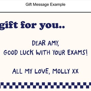 May include: A white card with blue text and symbols. The text reads "A gift for you... Dear Amy, Good luck with your exams! All my love, Molly xx".