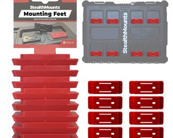 Può includere: Un pacchetto da 8 piedini di montaggio StealthMounts rossi, progettati per adattarsi alle cassette degli attrezzi Milwaukee PACKOUT. I piedini sono mostrati in una custodia di stoccaggio in plastica con il logo StealthMounts.