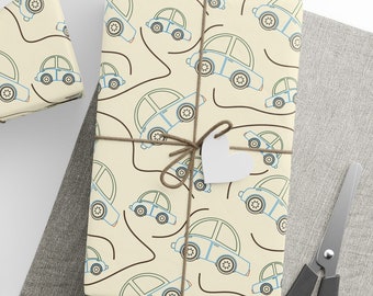 May include: Three gift boxes wrapped in cream paper with a blue and brown car pattern. The boxes are tied with twine and have white gift tags attached.