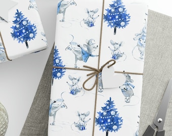 May include: Three white gift boxes wrapped in blue and white patterned paper with a watercolor design of mice ice skating and Christmas trees. The boxes are tied with twine and have white paper tags attached.