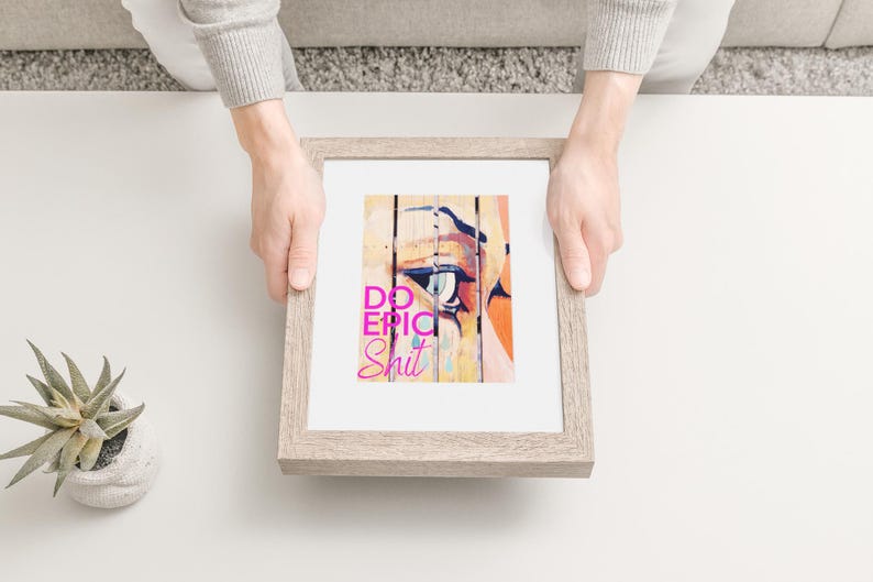 May include: A framed print with a colorful abstract design and the text "Do Epic Shit" in pink letters.