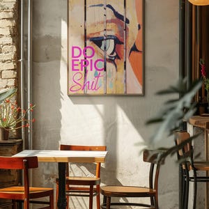 May include: A colorful abstract painting with a single eye and the text "DO EPIC SHIT" in pink letters.