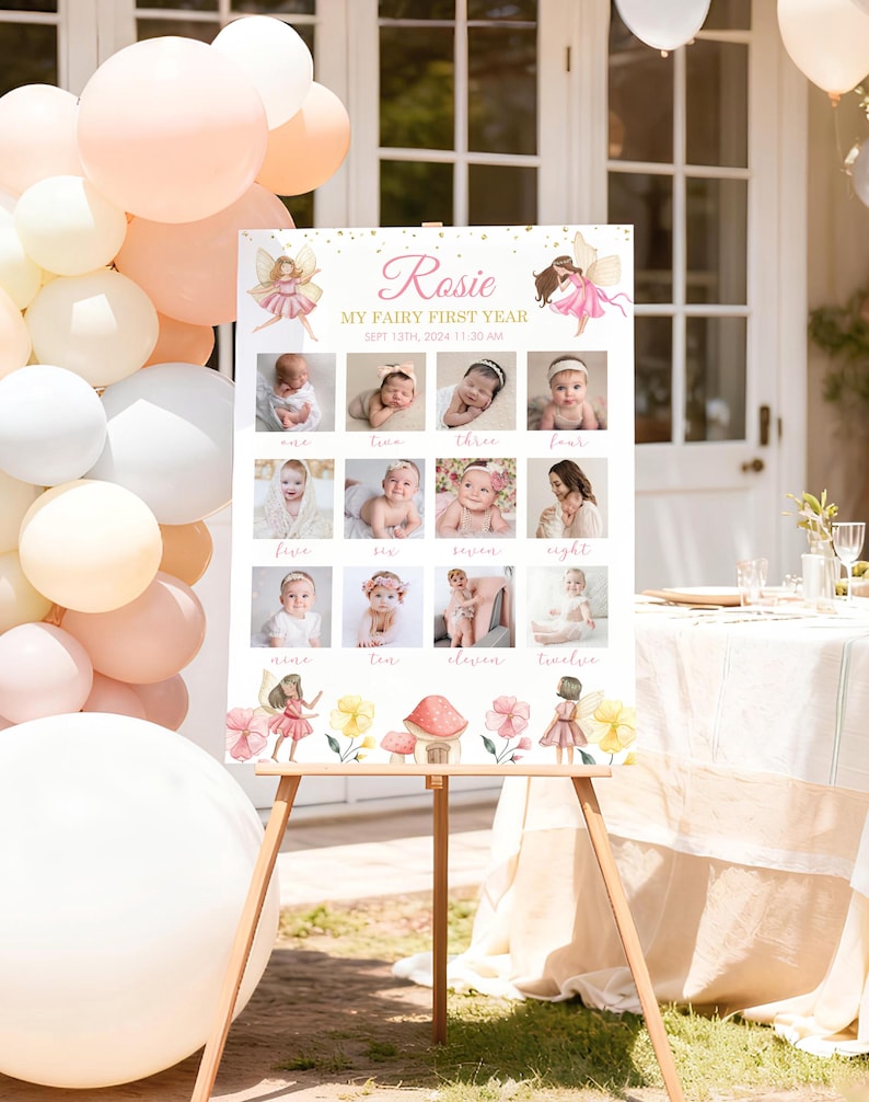 May include: A white rectangular milestone board featuring the text Rosie MY FAIRY FIRST YEAR SEPT 13TH, 2024 11:30 AM. The board displays twelve square photographs of a baby, each labeled with a month, decorated with watercolor fairy illustrations.