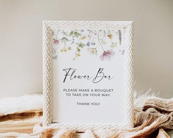 May include: A framed sign with the text "Flower Bar" in elegant script. The sign features a floral design at the top and the message "PLEASE MAKE A BOUQUET TO TAKE ON YOUR WAY. THANK YOU!" in a white frame.