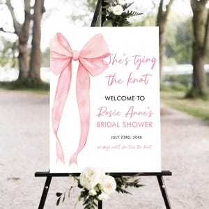 She&#39;s Tying the Knot Bridal Shower Welcome Sign, Editable Minimalist Pink Bow Bridal Shower Poster, Pink Ribbon Bow Wedding Shower Sign