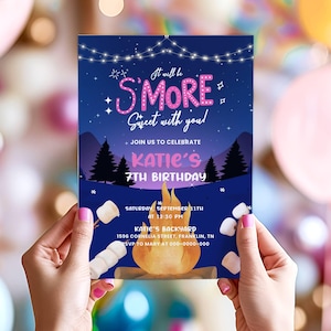 May include: A birthday invitation with a camping theme. The invitation reads "It will be S'more Sweet with you!" and includes details for Katie's 7th birthday, featuring a campfire graphic and marshmallow illustrations.