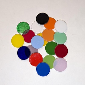 May include: Assortment of 16 colorful round glass tiles in various colors, including red, green, blue, yellow, orange, black, white, and purple.