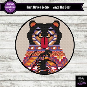 May include: A cross stitch pattern featuring a cartoon bear wearing a colorful patterned sweater. The bear is sticking its tongue out and has a playful expression. The pattern is titled "First Nation Zodiac - Virgo The Bear".