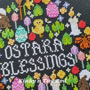 May include: A cross stitch pattern with a black background and white text that reads "Easter Blessings". The design is surrounded by colorful embroidered images of flowers, eggs, chicks, and candles.