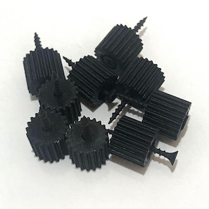 May include: A set of three ceramic mugs with a speckled, matte finish. The mugs are in shades of cream, light gray, and dark gray. Each mug has a simple, minimalist design, perfect for coffee or tea.