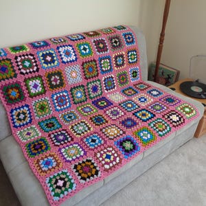 May include: A rectangular wooden sign with the words "Welcome to our porch" in white. The sign has a distressed finish, giving it a vintage look. A small heart decoration is also present, suggesting a country or farmhouse theme.