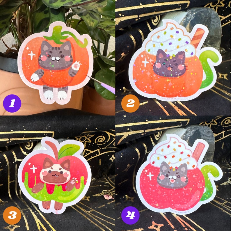 May include: Four colorful stickers featuring cartoon cats. One cat is in an orange pumpkin costume, another in a pumpkin-shaped drink with whipped cream, and two more in apple-shaped designs. Each sticker has a unique design and color scheme.