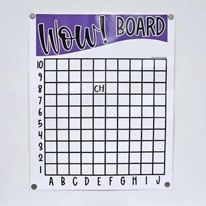 May include: A white Wow! Board with a purple banner at the top. The board has a grid of squares with numbers and letters along the sides. The word "CH" is written in one of the squares. The board is attached to a white wall.
