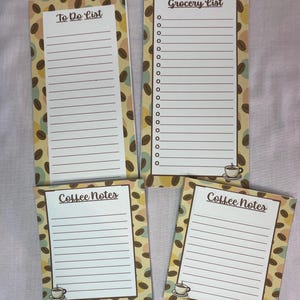May include: Four coffee-themed notepads with lined pages. Two pads say "Coffee Notes" and two say "To Do List" and "Grocery List". The pads have a coffee bean pattern border and a small coffee cup graphic.