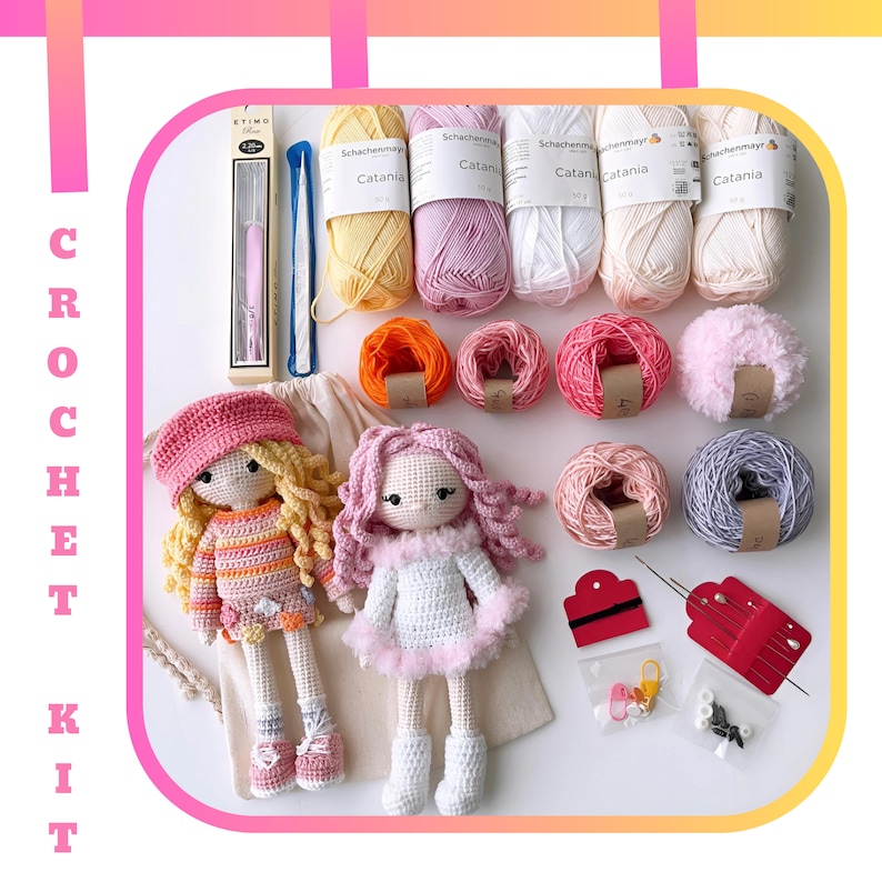 May include: Crochet kit with two amigurumi dolls, yarn in various colors, crochet hook, and other supplies. The dolls are dressed in pink and orange striped and white dresses. The yarn is labeled "Schachenmayr Catania".
