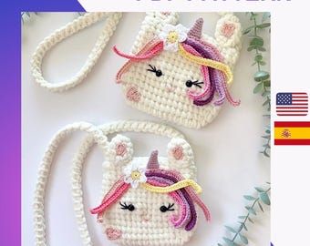 May include: Two white crocheted unicorn purses with pink, yellow, and purple yarn accents. The purses have a white crocheted strap and are perfect for carrying small items.