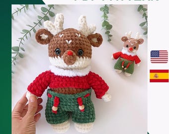 May include: Crochet pattern for a brown and white reindeer wearing a red sweater and green pants. The pattern is available in English and Spanish.
