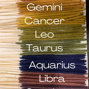 May include: A set of 12 incense sticks, each representing a different zodiac sign. The sticks are arranged vertically, with the sign name printed below each one. The signs are: Pisces, Aries, Virgo, Gemini, Cancer, Leo, Taurus, Aquarius, Libra, Capricorn, Sagittarius, and Scorpio.
