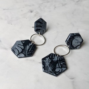 Dark blue medium sized hexagon earrings with silver jungle pattern/ Fitted with surgical steel posts