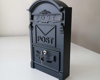 May include: Black metal mailbox with a keyhole and the word "POST" on the front.
