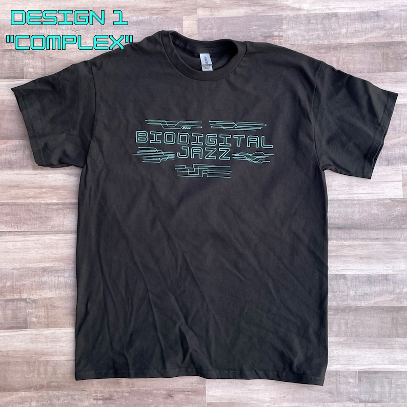 May include: Black t-shirt with a teal blue graphic design that says "Biodigital Jazz" with stylised lines.