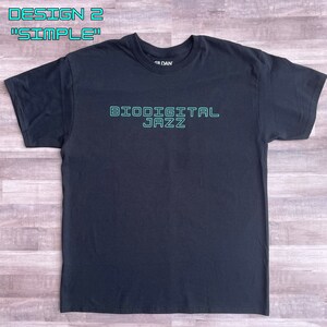 May include: Black t-shirt with the text "Biodigital Jazz" in green outlined letters.