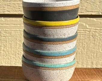 Small ice cream bowl in speckled clay and white satin with blue, black, yellow or seafoam. Price per bowl.