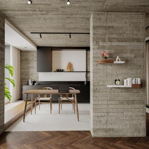 May include: A modern kitchen and dining area with a wooden table and chairs. A laptop sits on the table. The room features concrete walls, a black kitchen, and floating shelves with decor. A window with curtains is visible.