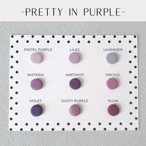 May include: A color palette titled "Pretty in Purple" featuring nine circular color swatches in various shades of purple, including pastel purple, lilac, and violet. The swatches are arranged on a white card with black polka dots.