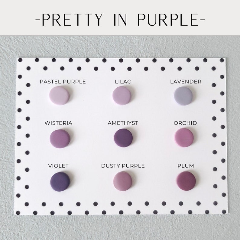 May include: A color palette titled "Pretty in Purple" featuring nine circular color swatches in various shades of purple, including pastel purple, lilac, and violet. The swatches are arranged on a white card with black polka dots.
