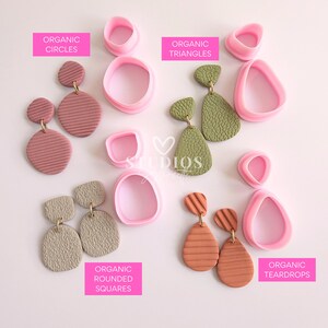 May include: A collection of handmade polymer clay earrings in various shapes and colors, including pink, green, and terracotta. The earrings are displayed with matching pink clay cutters labeled "Organic Circles," "Organic Triangles," "Organic Rounded Squares," and "Organic Teardrops."