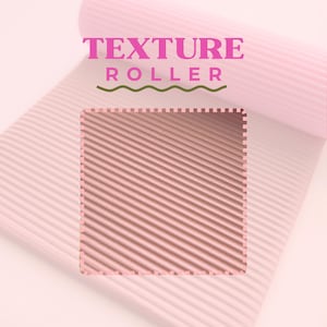 May include: A pink texture roller with a corrugated surface, partially unrolled, revealing the textured pattern. The words "TEXTURE ROLLER" are displayed in pink, above a green wavy line.