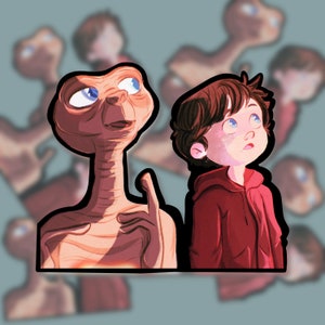 May include: A cartoon illustration of a brown alien with large eyes and a human boy looking up at the sky. The alien is wearing a red shirt and the boy is wearing a red hoodie.