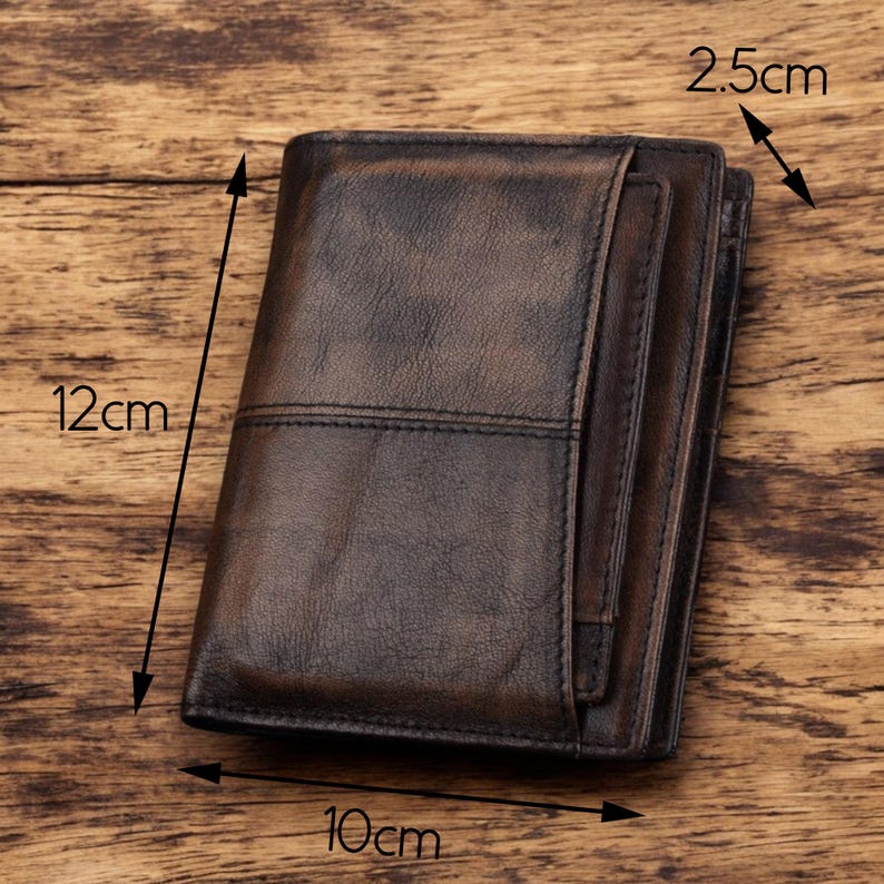 May include: A brown leather wallet with a stitched design. The wallet measures 12 inches by 10 inches by 2.5 inches.