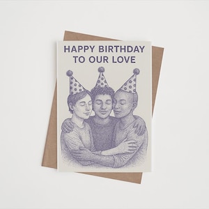 May include: A greeting card with the text "HAPPY BIRTHDAY TO OUR LOVE" and an illustration of three people hugging, wearing party hats. The card is on a brown envelope, set against a white background.