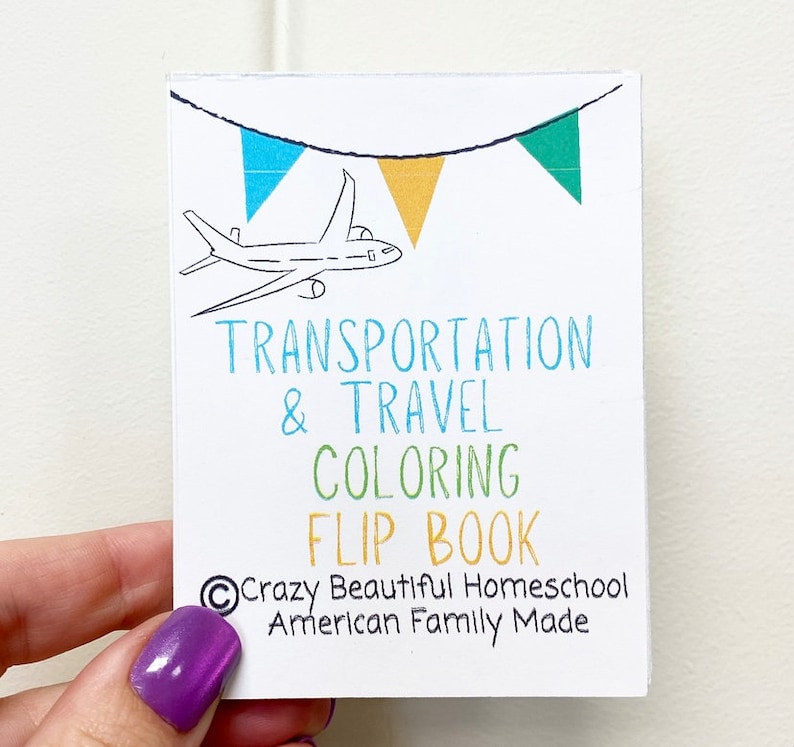 May include: A white coloring book with a blue, yellow, and green bunting at the top. The book has the title "Transportation & Travel Coloring Flip Book" and the text "Crazy Beautiful Homeschool American Family Made".