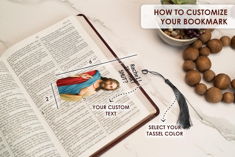 May include: A clear acrylic bookmark with a religious image and the text "Rachel! Is That Smut?"  The bookmark is 6 inches long and 2 inches wide. It has a black tassel.