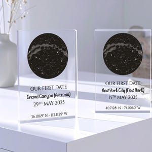 May include: Two clear acrylic blocks with a black circular star map design. Each block has the text "OUR FIRST DATE" and location and date details. One says Grand Canyon, Arizona, May 29th, 2025. The other says New York City, New York, May 15th, 2025.