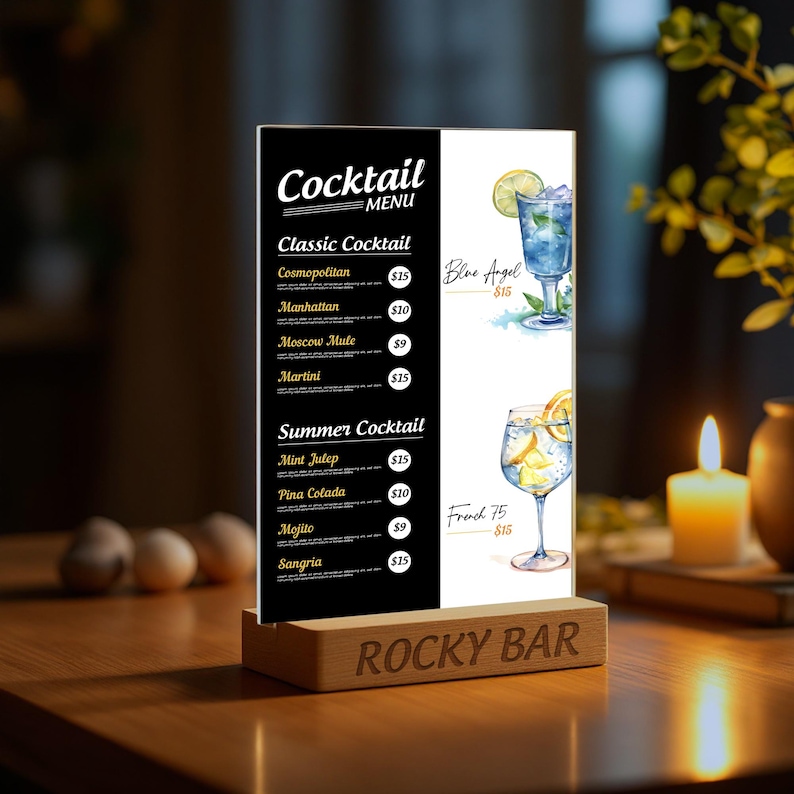 May include: A black and white cocktail menu sign with a wooden base. The sign lists classic and summer cocktails with prices. The sign reads "Cocktail Menu" and "Rocky Bar".
