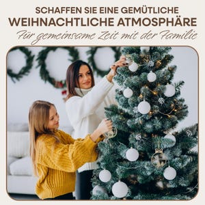 May include: A mother and daughter decorate a Christmas tree with white ornaments. The tree is decorated with white ornaments and a wooden ornament that says "Weihnachten". The text on the image reads "Schaffen Sie eine gem&uuml;tliche weihnachtliche Atmosph&auml;re f&uuml;r gemeinsame Zeit mit der Familie".
